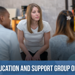Small group of people sitting in a circle in a group session.